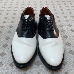 Elegant pair of Thom Browne Men’s Black and White Saddle Shoes